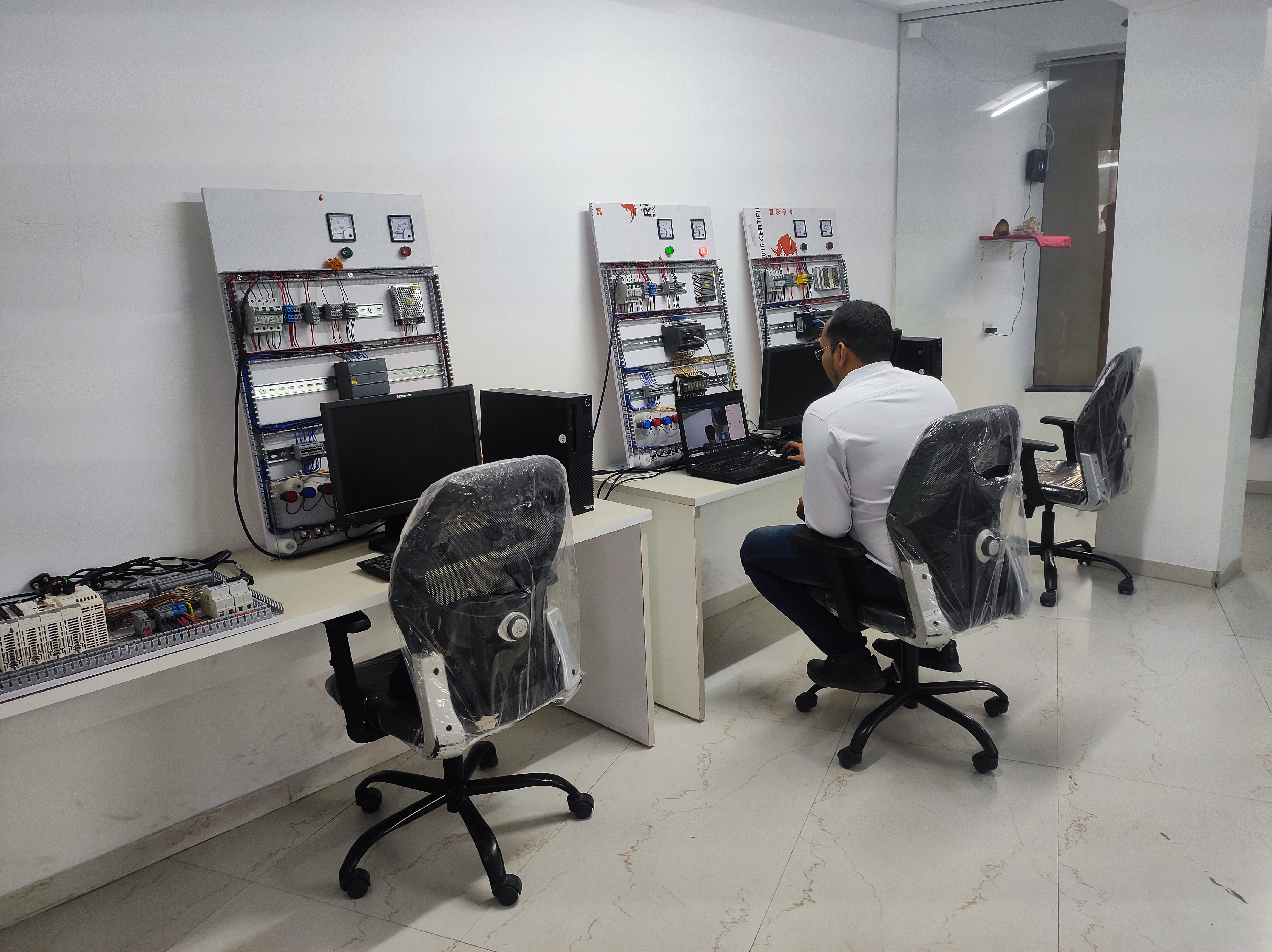 Students engaged in panel wiring